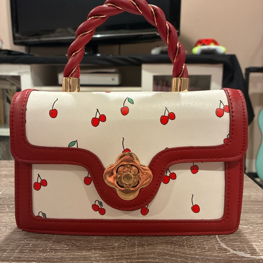 Cherry purse w/ gold hardware